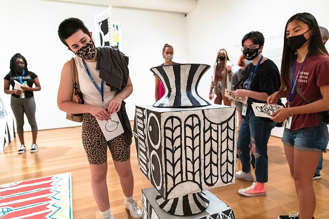 Students at art exhibit